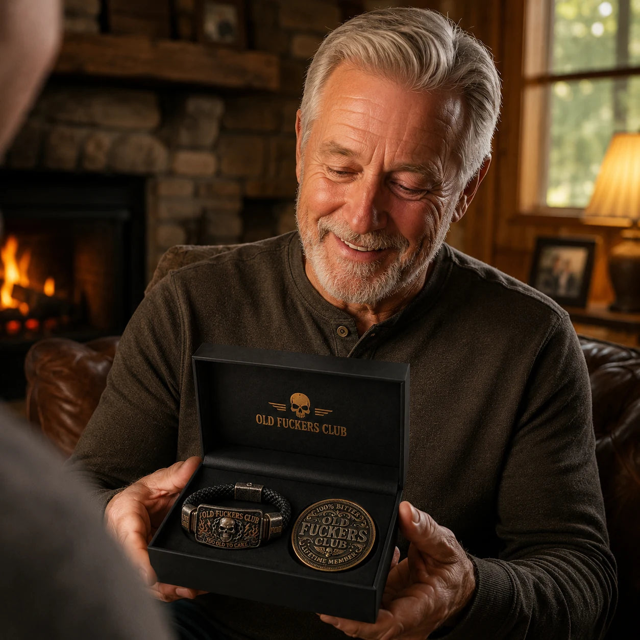 Old Fuckers Club bracelet and collector coin displayed in a black gift box